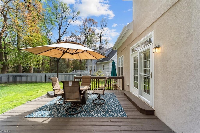 wooden terrace with outdoor dining space