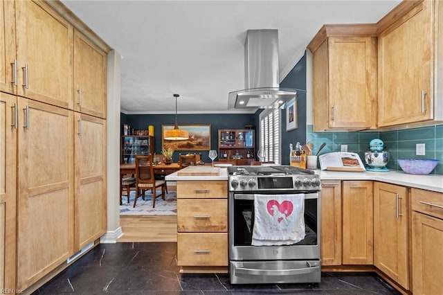kitchen featuring stainless steel range with gas stovetop, ornamental molding, light countertops, ventilation hood, and pendant lighting