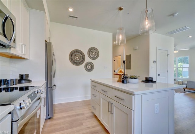 410 Carolina Ave, Norfolk, VA 23508 - kitchen featuring stainless steel appliances, white cabinetry, light countertops, a kitchen island, and light wood-type flooring