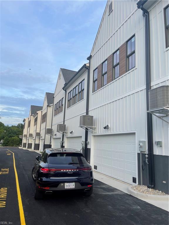 410 Carolina Ave, Norfolk, VA 23508 - view of building exterior featuring a garage and a residential view