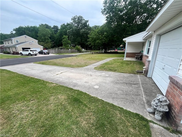 3328 Northgate Dr, Virginia Beach, VA 23452 - view of grassy yard with a garage