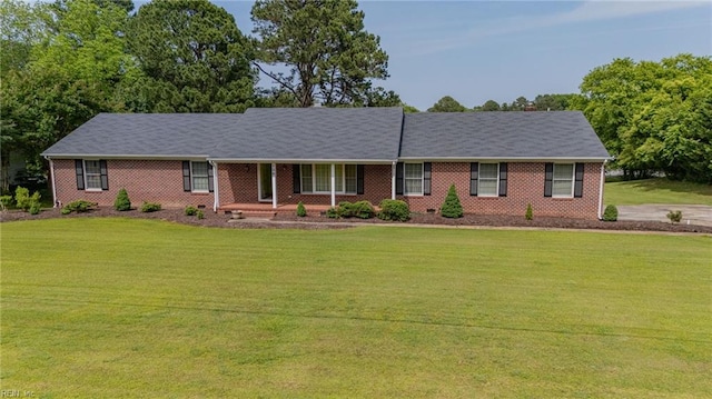 136 Crescent Dr, Franklin, VA 23851 - ranch-style house featuring a porch, a front lawn, and brick siding