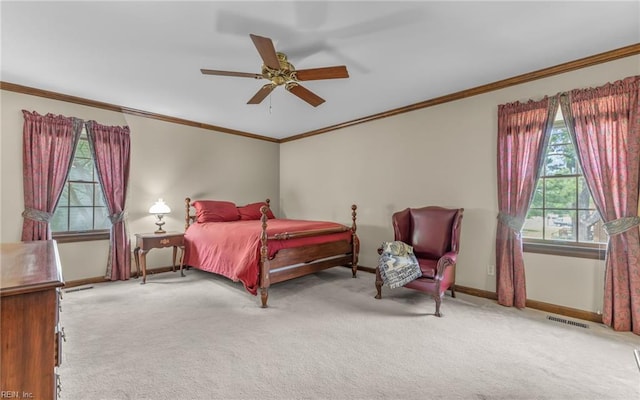136 Crescent Dr, Franklin, VA 23851 - bedroom with carpet floors, baseboards, crown molding, and ceiling fan