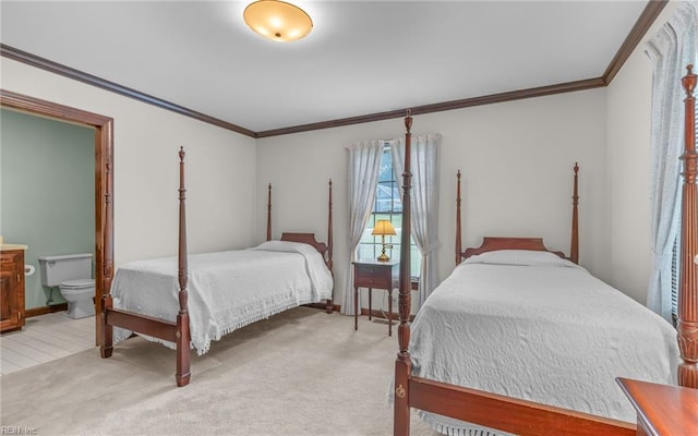 136 Crescent Dr, Franklin, VA 23851 - bedroom featuring crown molding, ensuite bathroom, and light colored carpet
