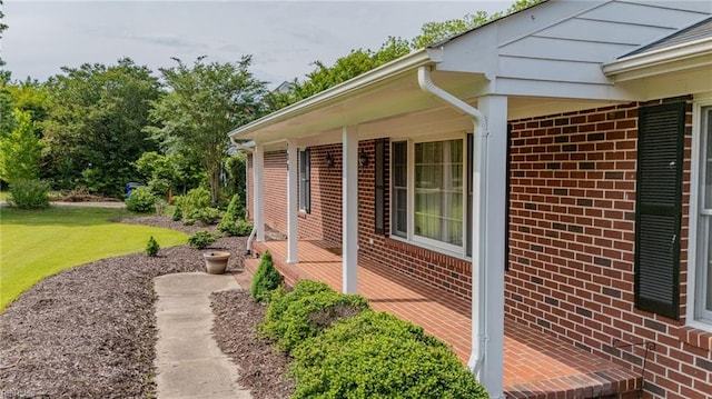 136 Crescent Dr, Franklin, VA 23851 - view of side of property with a yard and brick siding
