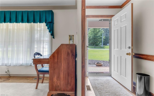 136 Crescent Dr, Franklin, VA 23851 - doorway to outside featuring crown molding, wood finished floors, and baseboards