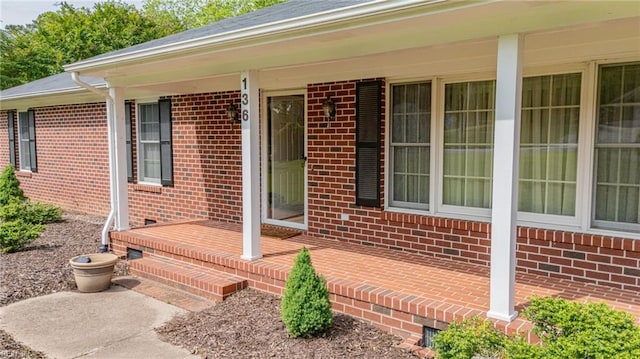 136 Crescent Dr, Franklin, VA 23851 - property entrance with covered porch and brick siding