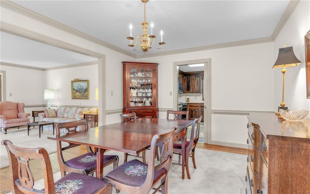 136 Crescent Dr, Franklin, VA 23851 - dining space with a chandelier and crown molding