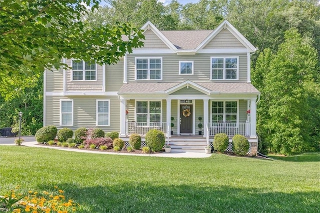 7935 Patriots Landing Pl, Quinton, VA 23141 - view of front of house featuring a porch, a front lawn, and a shingled roof