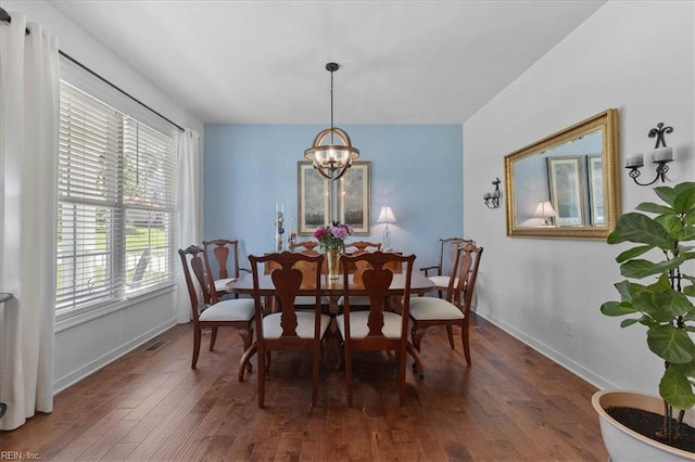 7935 Patriots Landing Pl, Quinton, VA 23141 - dining room with a chandelier, wood-type flooring, and baseboards