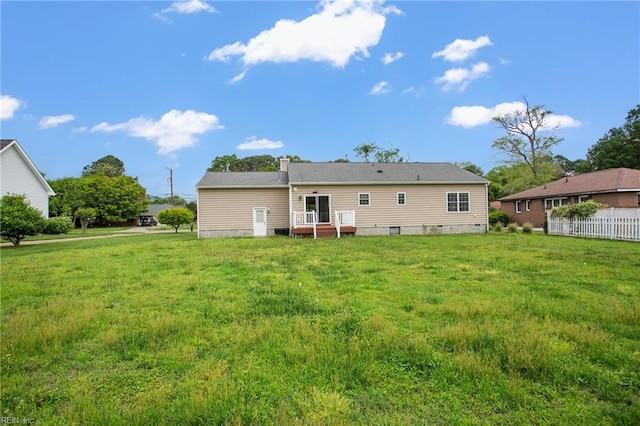 back of house featuring crawl space and a deck
