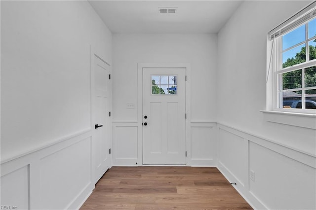 20 Kimberly Ave, Hampton, VA 23663 - doorway featuring healthy amount of natural light, a decorative wall, light wood-style floors, and a wainscoted wall