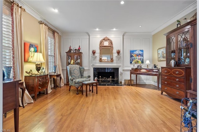 111 Riverside Dr, Suffolk, VA 23435 - sitting room featuring wood finished floors, a premium fireplace, crown molding, and a decorative wall