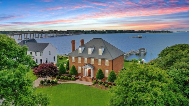 111 Riverside Dr, Suffolk, VA 23435 - view of front facade featuring a water view and a chimney