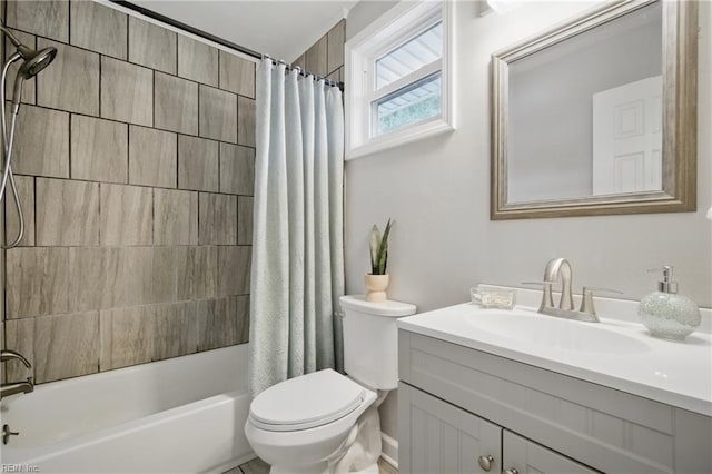 bathroom with toilet, shower / tub combo, and vanity