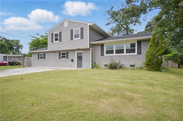 split level home featuring concrete driveway