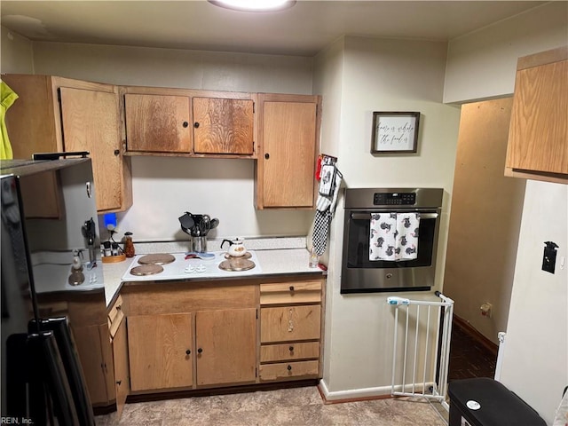 3541 Bow St, Virginia Beach, VA 23464 - kitchen with stainless steel oven, light countertops, freestanding refrigerator, and baseboards