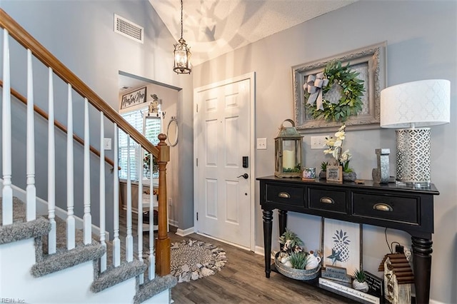 455 Fairway Lookout, Williamsburg, VA 23188 - entryway with stairs, dark wood-type flooring, a chandelier, and baseboards