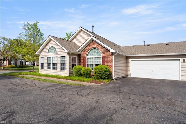 200 Tabb Smith Trl, Yorktown, VA 23693 - ranch-style house featuring driveway, a garage, a shingled roof, and brick siding