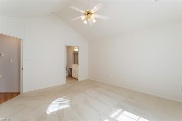 200 Tabb Smith Trl, Yorktown, VA 23693 - unfurnished bedroom featuring light colored carpet, high vaulted ceiling, baseboards, ensuite bath, and ceiling fan