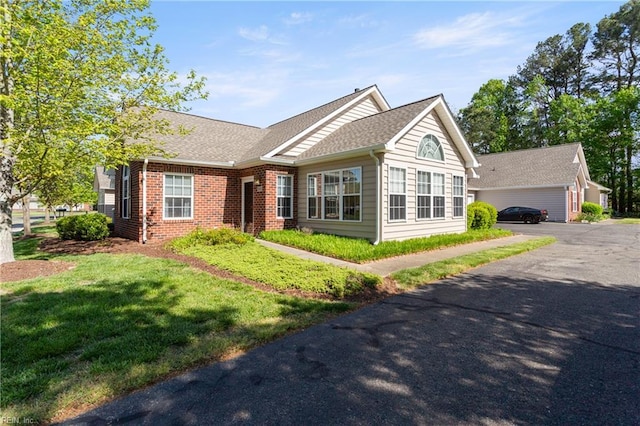 200 Tabb Smith Trl, Yorktown, VA 23693 - ranch-style house featuring brick siding, a shingled roof, and a front lawn