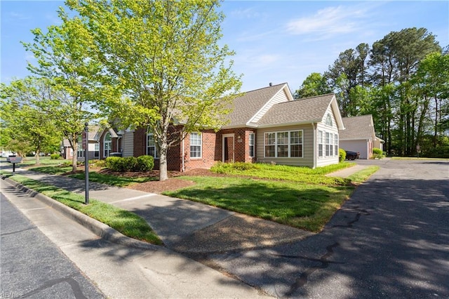 200 Tabb Smith Trl, Yorktown, VA 23693 - view of front of home with brick siding, a detached garage, and a front yard