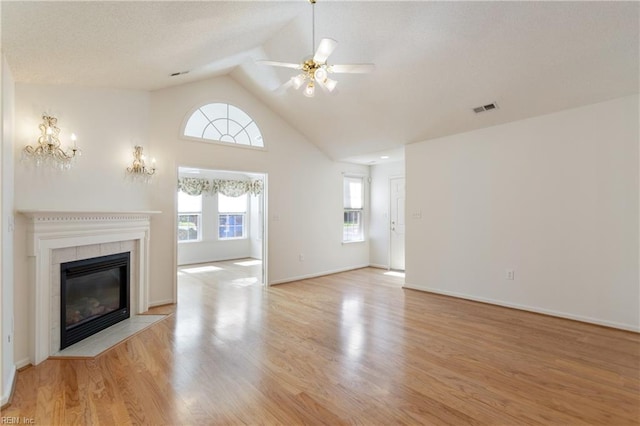 200 Tabb Smith Trl, Yorktown, VA 23693 - unfurnished living room featuring a fireplace, a ceiling fan, wood finished floors, baseboards, and high vaulted ceiling