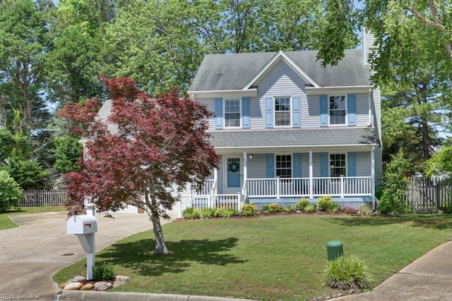 view of front of home with covered porch, a chimney, a shingled roof, and concrete driveway