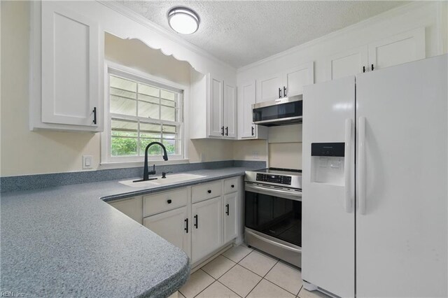 155 Colony Rd, Newport News, VA 23602 - kitchen with appliances with stainless steel finishes, a sink, a textured ceiling, white cabinetry, and crown molding