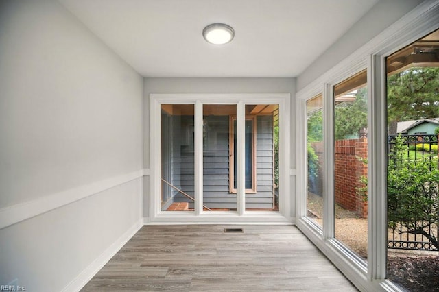 38 Yeardleys Grant, Williamsburg, VA 23185 - unfurnished sunroom featuring wood finished floors and baseboards