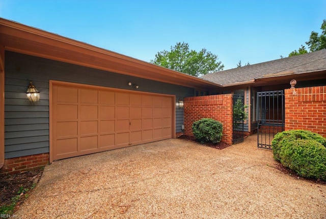 38 Yeardleys Grant, Williamsburg, VA 23185 - view of front facade featuring concrete driveway, brick siding, a garage, and roof with shingles