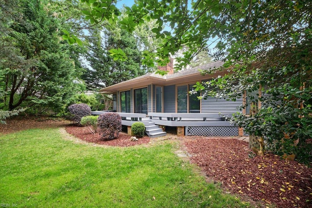 38 Yeardleys Grant, Williamsburg, VA 23185 - rear view of property featuring a yard, a chimney, and a sunroom