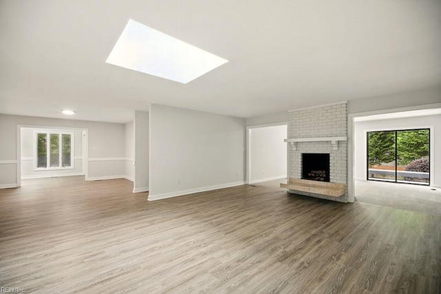 38 Yeardleys Grant, Williamsburg, VA 23185 - unfurnished living room with wood finished floors, baseboards, and a fireplace