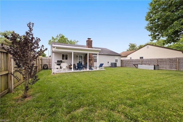 1117 Confederate Cres, Virginia Beach, VA 23453 - rear view of house featuring a chimney, a patio, and central AC