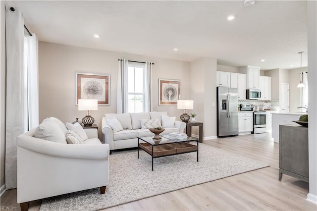 268 Tern Ave, Portsmouth, VA 23701 - living room with light wood-style floors, baseboards, and recessed lighting
