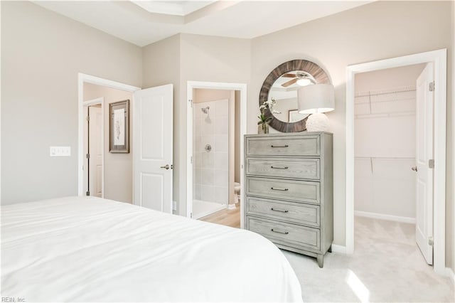 268 Tern Ave, Portsmouth, VA 23701 - bedroom with a spacious closet, a closet, ensuite bathroom, and light carpet