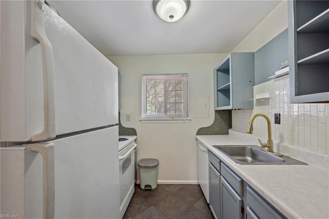 kitchen featuring white appliances, open shelves, a sink, light countertops, and baseboards