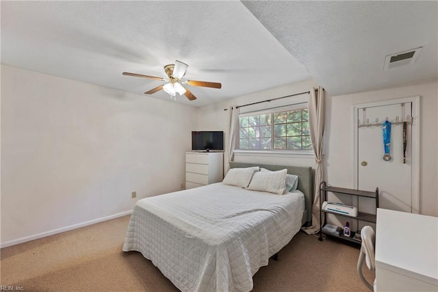 bedroom with carpet flooring, baseboards, and a ceiling fan