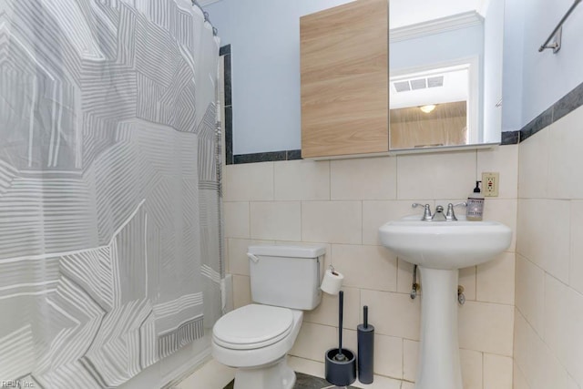 804 Spencer Ct, Virginia Beach, VA 23451 - bathroom featuring tile walls, toilet, and a shower with shower curtain