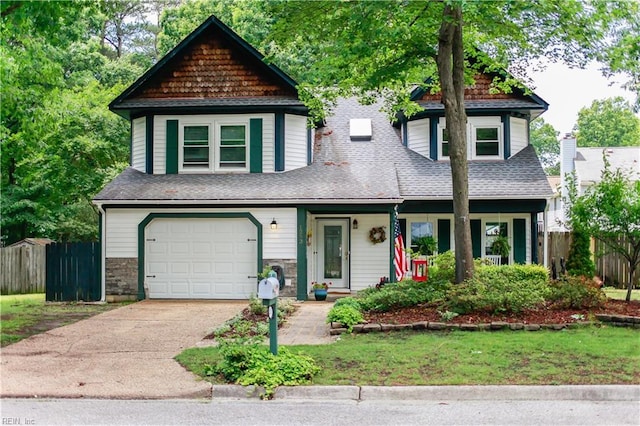 view of front of property featuring fence, an attached garage, a porch, and concrete driveway