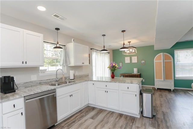 823 Jessie Cir, Newport News, VA 23608 - kitchen with stainless steel dishwasher, a sink, a peninsula, white cabinetry, and light wood finished floors