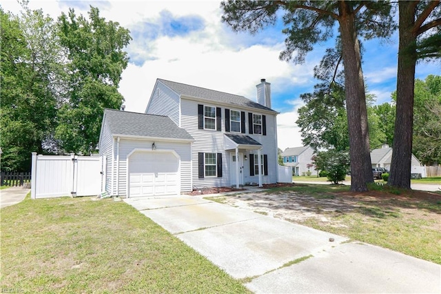 823 Jessie Cir, Newport News, VA 23608 - colonial house featuring an attached garage, a chimney, and concrete driveway