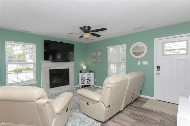 823 Jessie Cir, Newport News, VA 23608 - living area featuring a ceiling fan, light wood-style floors, baseboards, and a high end fireplace
