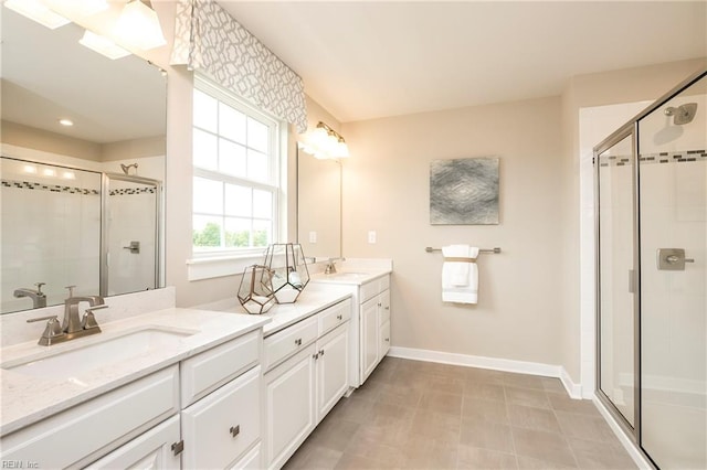 1115 Egret Ln, Suffolk, VA 23434 - bathroom featuring a shower stall, double vanity, and baseboards