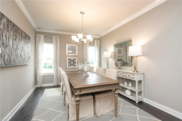 1115 Egret Ln, Suffolk, VA 23434 - dining area with a chandelier, crown molding, baseboards, and wood finished floors