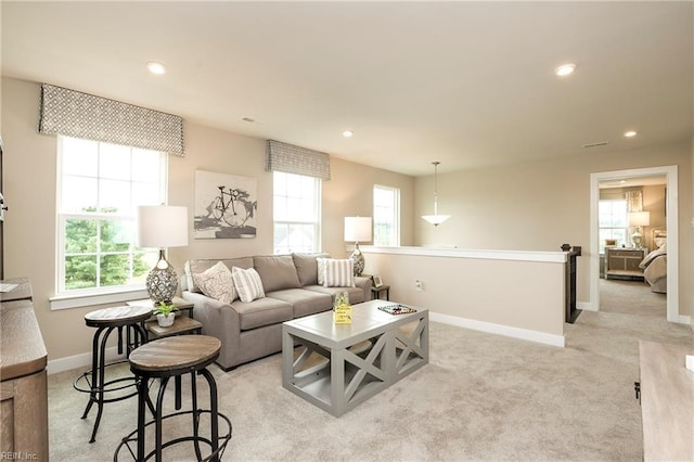 1115 Egret Ln, Suffolk, VA 23434 - living room featuring plenty of natural light, baseboards, recessed lighting, and light colored carpet