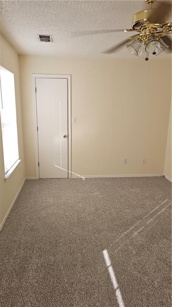 3513 Radford Cir, Chesapeake, VA 23321 - unfurnished room with ceiling fan, baseboards, a textured ceiling, and carpet floors
