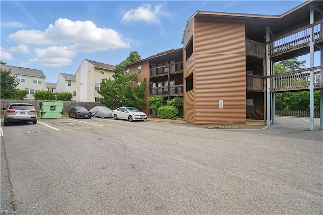 8530 Tidewater Dr Unit 111, Norfolk, VA 23503 - view of building exterior featuring uncovered parking and fence