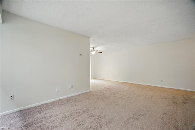 8530 Tidewater Dr Unit 111, Norfolk, VA 23503 - empty room with light carpet, ceiling fan, and baseboards