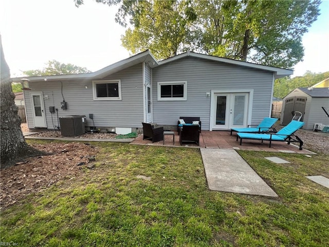 3213 Northgate Dr, Virginia Beach, VA 23452 - rear view of house with cooling unit, french doors, a patio area, and a lawn
